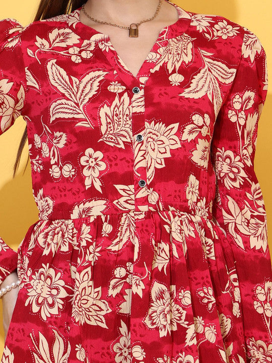 Maroon women's top with cream floral print, button front, long sleeves, V-neckline.